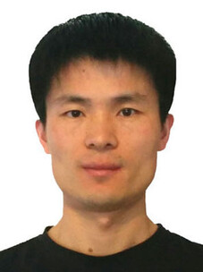 Libo Ma in schwarzem Shirt, neutraler Gesichtsausdruck vor weißem Hintergrund.